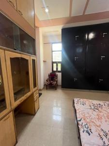 a room with a large screen in a room at Guru hotel in Sūratgarh