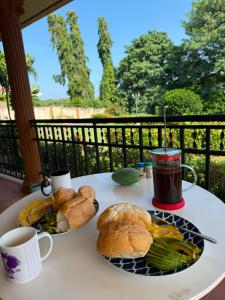 a table with two plates of food and a cup of coffee at Mansion Sublime in Chitré