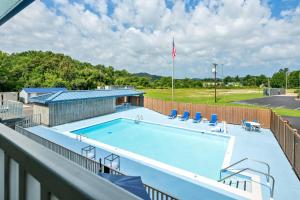 a swimming pool on the balcony of a house at Quality Inn in Barbourville