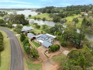 an aerial view of a house next to a river at Lakes Edge Retreat in Yungaburra
