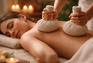 a woman laying on a bed with two massage balls at Residence Lou Naouc in Grasse