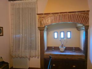 a room with a large mirror and a wooden dresser at Arhodico Simou mansion in Kambos