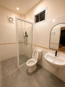 a bathroom with a shower and a toilet and a sink at Phuyafahsai The Resort Khao Kho in Khao Kho +194 photos