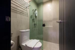 a bathroom with a toilet and a glass shower at Salee Boutique Hotel in Chiang Mai +55 photos