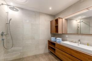 a bathroom with a sink and a shower at Residence Diana Apartment 401 in Terento +23 photos