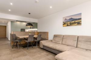 a living room with a couch and a table at Residence Diana Apartment 401 in Terento