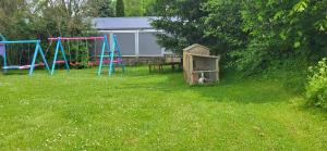 a group of playground equipment in a yard at Ferienwohnung Büffel in Niedenstein