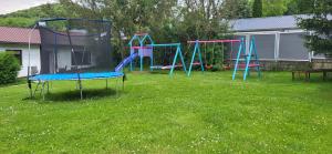 a group of playground equipment in a yard at Ferienwohnung Büffel in Niedenstein +4 photos