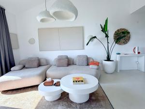 a living room with a couch and a table at Seaside Luxury Apartment - Lozenetz in Lozenets