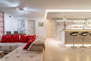 a living room with a couch and a bar at Villa Angela in Capannori