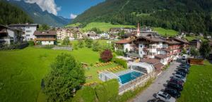 an aerial view of a village with a resort at Olympia-Relax-Hotel Leonhard Stock in Finkenberg