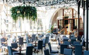 a dining room with tables and chairs at Crowne Plaza Terrigal Pacific by IHG in Terrigal