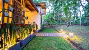 a courtyard of a house with a garden at Sansevieria Homestay in Sigiriya