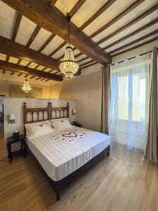 a bedroom with a large bed and a large window at Garden Palace Hotel in Castiglione del Lago +75 photos