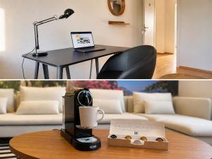 a room with a table with a coffee cup and a lamp at Cool Apart Chemnitz in Chemnitz