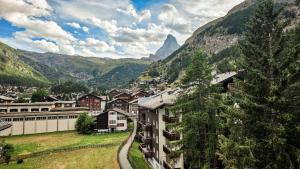 a town in the mountains with a mountain at central sky-penthouse with iconic matterhorn view in Zermatt