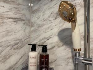 two bottles of soap on a counter in a bathroom at 伊勢神楽別邸 in Ise +78 photos