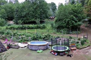 an aerial view of a garden with a hot tub and a swimming pool at LandAuszeit Hummeltal in Culm