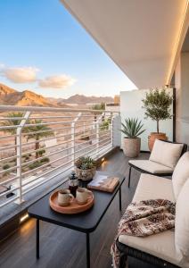 a living room with a balcony with a view at נווה ים סוף - מתחם דירות נופש פרימיום באילת in Eilat