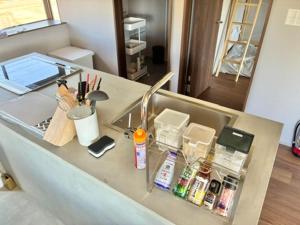 a counter top with alot of items on it at The Glow Omachi B棟 in Omachi