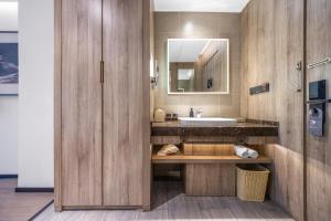 a bathroom with a sink and a mirror at Atour Hotel Yancheng Gorvernment in Yancheng