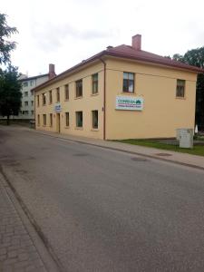 a building on the side of a street at Baumanis klasika in Valmiera +1 photo
