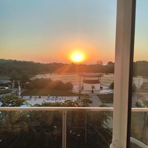 a sunset view from a window of a campus at Condo Blaxy Resort Olimp in Olimp