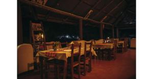 a row of tables and chairs in a restaurant at Lake Natron Tented Camp in Mtowabaga