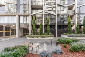 a courtyard in front of a building at 2BR-1BR-1Car- CBD Pool Central in Canberra