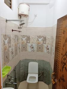 a bathroom with a toilet and a sink at La town beach stay in Pondicherry +24 photos
