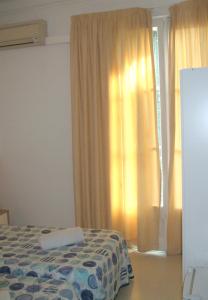 Llit o llits en una habitació de Hostal Felipe 2