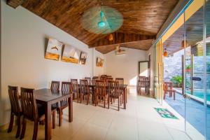 a dining room with a table and chairs at Tam Coc Cosiana Hotel in Ninh Binh