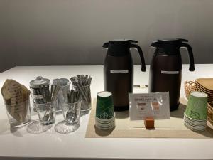 a table with two coffee makers and glasses on it at plat hostel keikyu minowa forest in Tokyo +28 photos