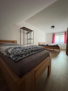 a bedroom with a bed with a blanket on it at Pallov Dvor in Lutiše