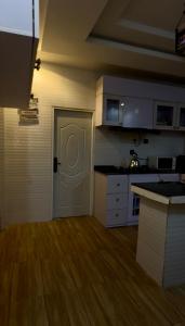 a kitchen with a white door in a room at St Kora Apartment and Shortlets in Asaba +15 photos