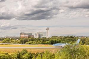 an airplane is taking off from an airport runway at Radisson Blu Arlandia Hotel, Stockholm-Arlanda in Arlanda