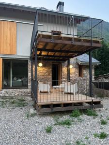 a house with a deck with chairs on it at La Francesa de Eriste in Sahun