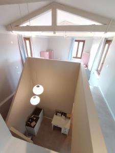 an overhead view of a room with a table and windows at Protezione della Giovane - female hostel in Verona