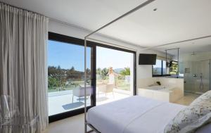 a bedroom with a bed and a view of a bathroom at Can Pep De Sa Guaita in Sóller +27 photos