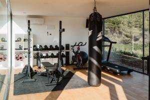 a gym with a punching bag hanging from the ceiling at Can Pep De Sa Guaita in Sóller
