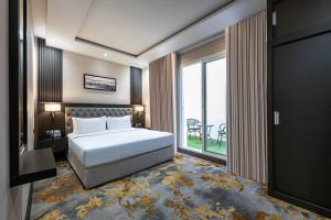 a bedroom with a bed and a large window at Sama Inn Hotel in Riyadh +89 photos