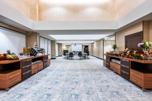 an office lobby with a cafeteria with food at Sama Inn Hotel in Riyadh