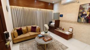 a living room with a couch and a table at Royal Richmond Hotel in Dhaka