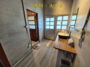 a bathroom with a sink and a mirror at 未半文旅 in Yilan City +20 photos