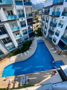 an overhead view of a swimming pool between two buildings at Konyaalti Suite Hotel in Antalya +14 photos