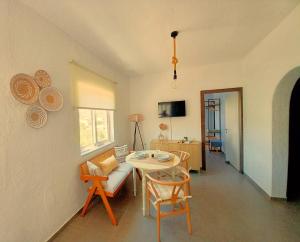 a living room with a table and a couch at Dimitra Apartments in Agios Nikolaos