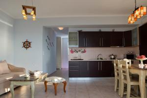 Kuchyň nebo kuchyňský kout v ubytování Amalia Apartments