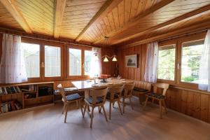 a dining room with a table and chairs at Central in Wildhaus