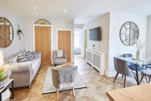 a living room with a couch and a table at The Hampton Garden in Whitby