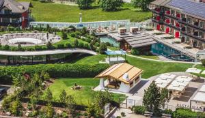 an aerial view of a building with a garden at Hotel Alpenroyal - The Leading Hotels of the World in Selva di Val Gardena